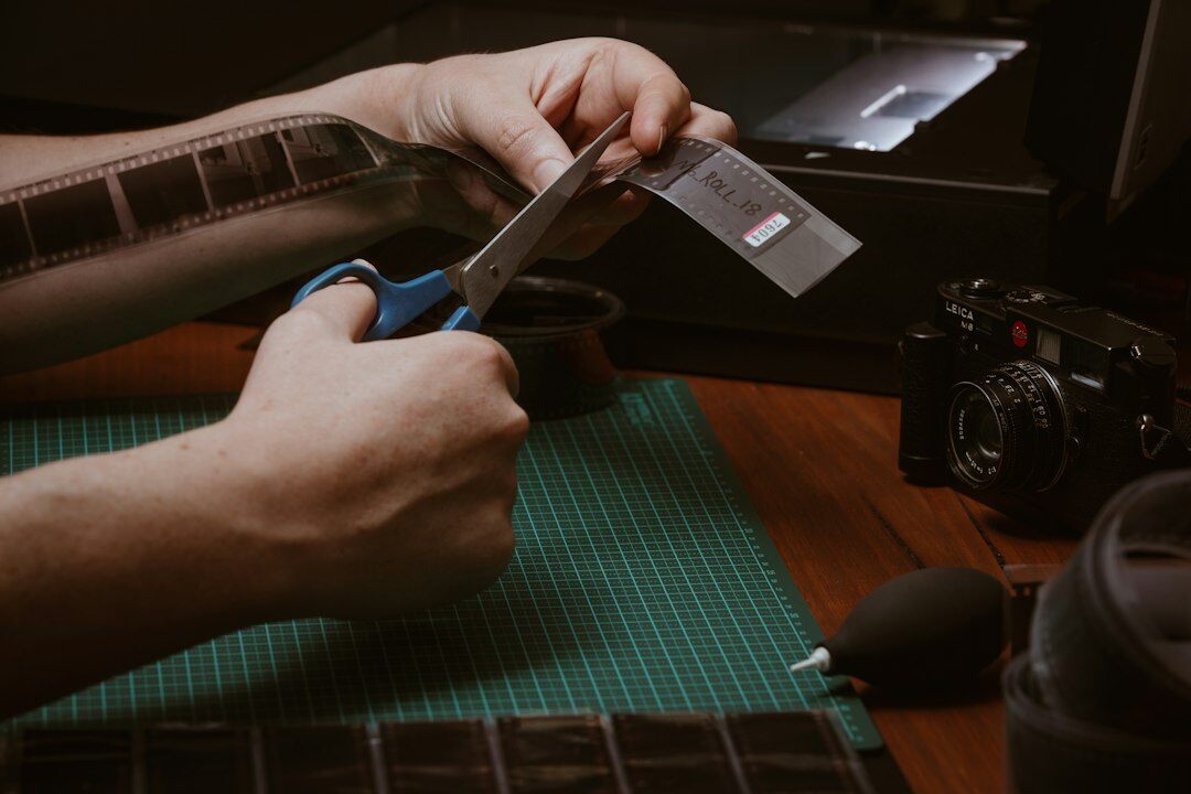 Close up of hands cutting a timeline on an editing software timeline