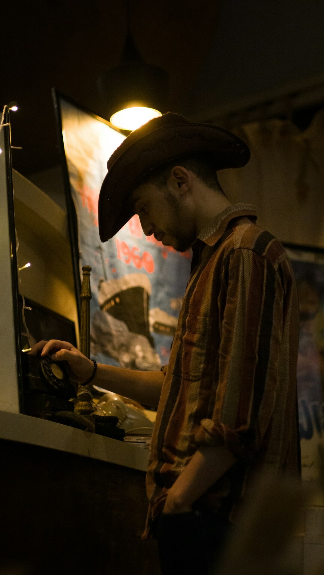 Colourist working with a control panel in front of a large monitor