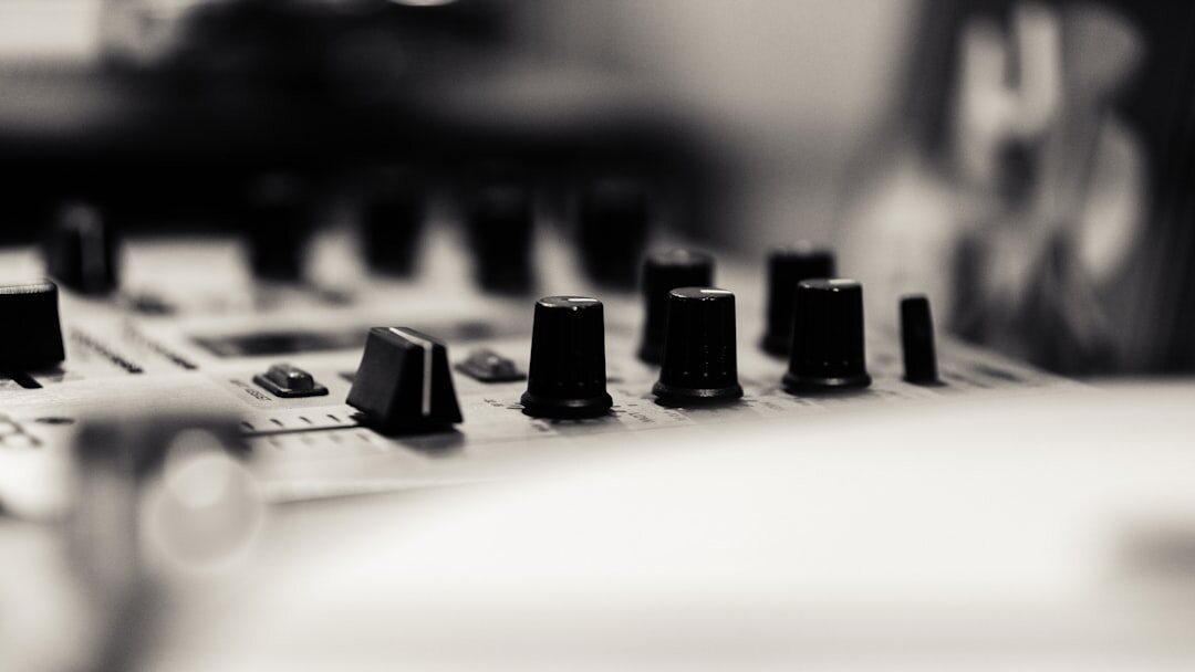 Audio engineer mixing sound at a mixing console