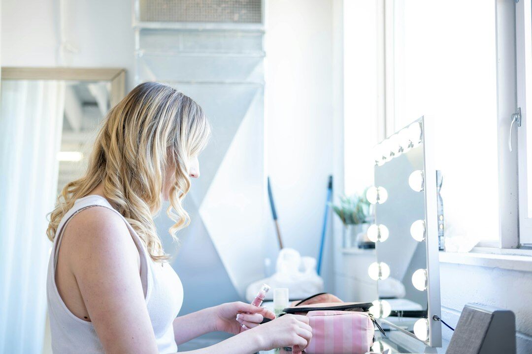 Editor reviewing footage on a laptop in a bright studio